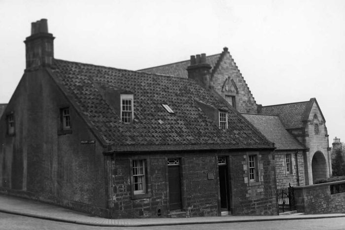 A monochrome photograph of the Scottish cottage where Andrew Carnegie was born.