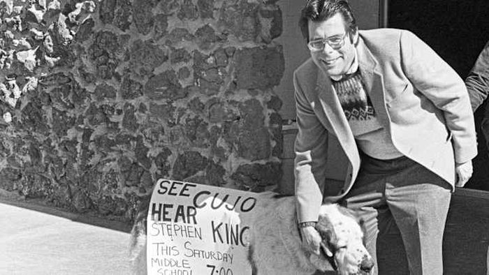 Stephen King alongside a fluffy companion.