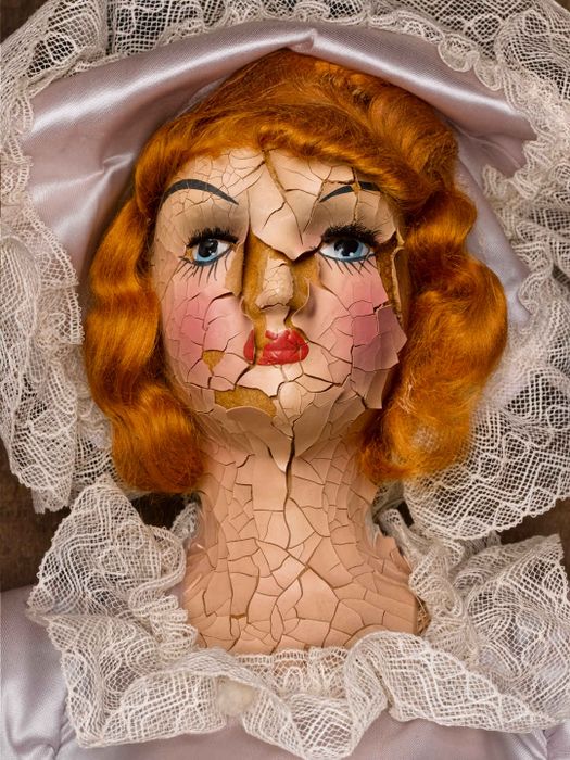 cracked old doll head
