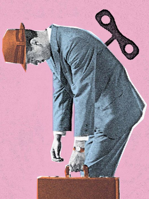 man with briefcase with a wind-up device in his back