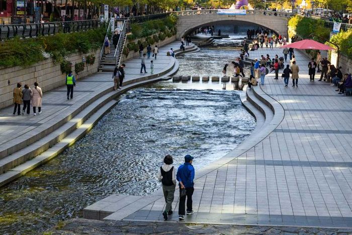 Visitors explore Cheonggyecheon in central Seoul.