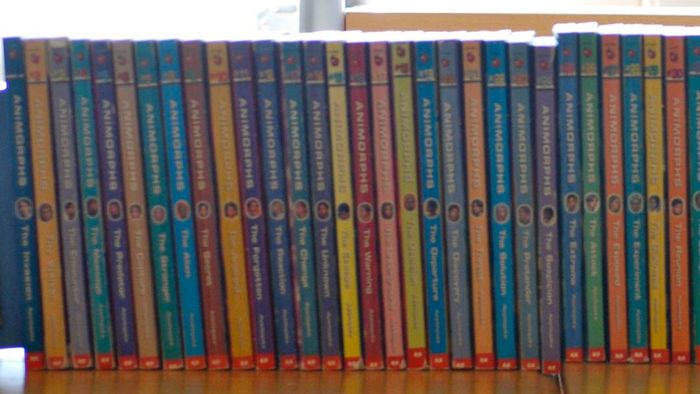 A shelf stocked with books from the Animorphs series.