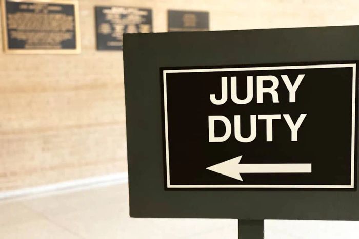 A sign indicating jury duty is displayed