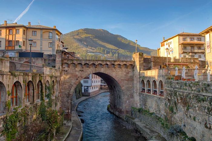 The historic bridge spanning the river in Potes, Spain