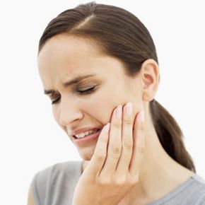 woman experiencing tooth pain