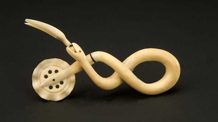 A scrimshaw pie crimper or jagging wheel crafted from the tooth of a sperm whale—just one of the many peculiar love tokens from ancient times.