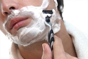 close-up of a man shaving