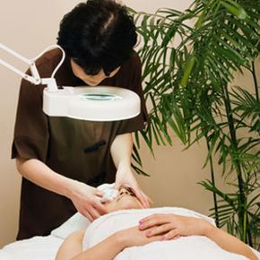A woman undergoing a facial skin treatment.