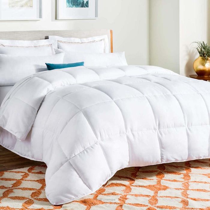 LINENSPA All-Season Hypoallergenic Down Alternative Microfiber Comforter beautifully laid on a bed.