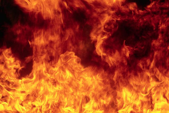 A towering wall of flames