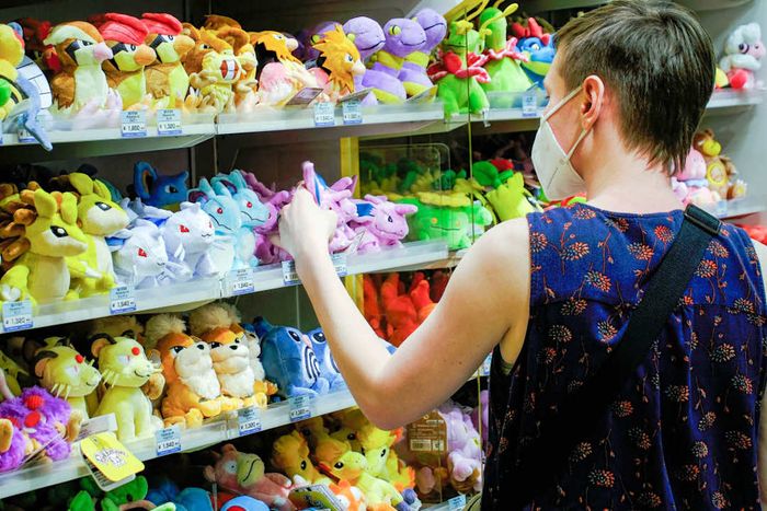 A shopper browses at a Pokémon Store in Tokyo Station...
