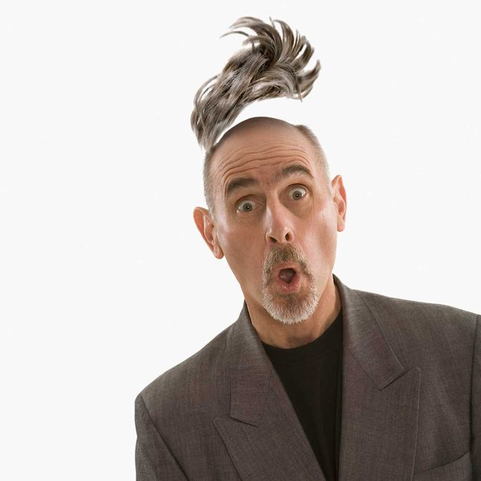 A man losing his toupee in a dramatic fashion