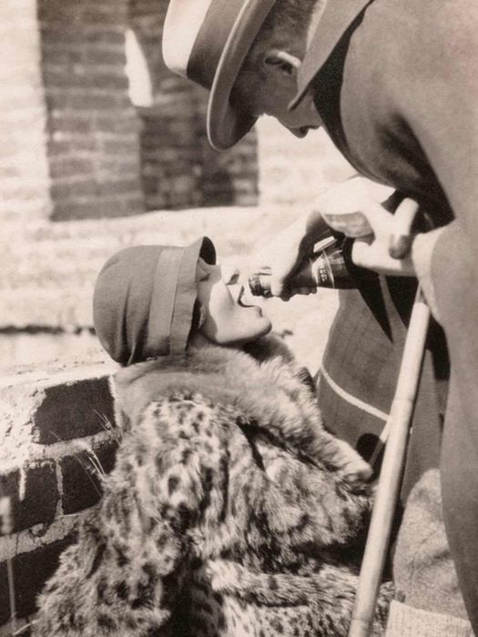 Woman enjoying champagne (France). Circa 1930.