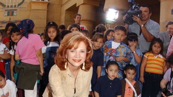 Barbara Handler, the daughter of Ruth Handler and the namesake behind Barbie, is seen placing her hands in cement outside the Egyptian Theatre in Hollywood, California, in 2002.