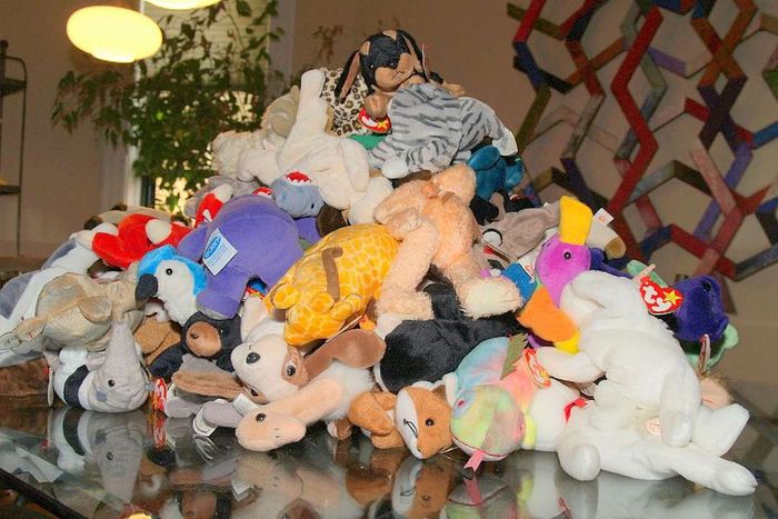 A table covered with a pile of Beanie Babies.