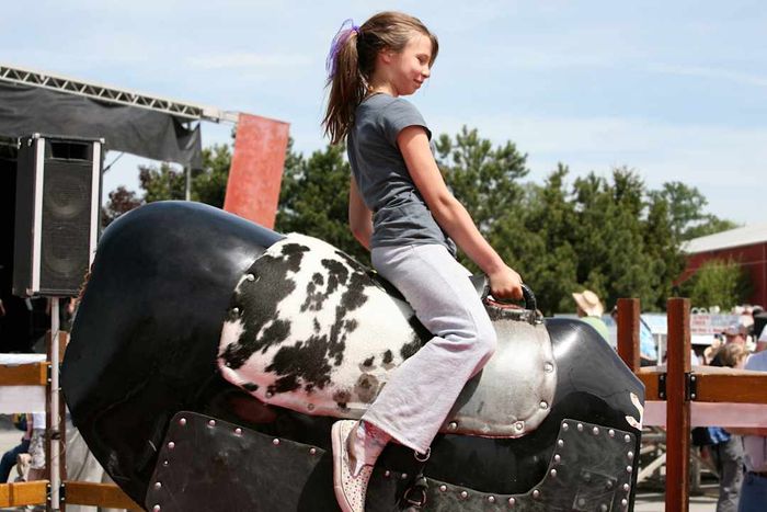 Aspiring cowgirl takes a ride on the Mechanical Bull