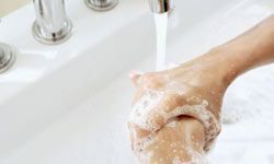 hands being washed under running water