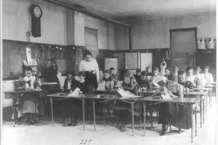 An 18th-century photograph of girls attending a sewing class