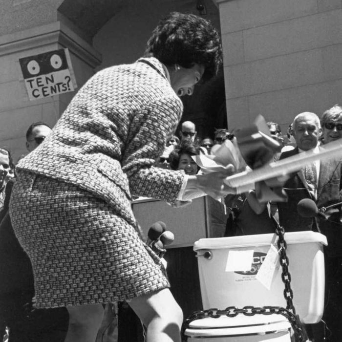 March Fong Eu is shown demolishing a toilet