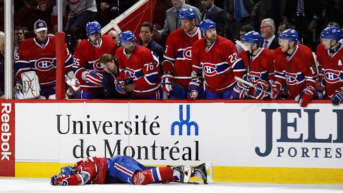 Max Pacioretty collapses on the ice following a fierce body check from Zdeno Chara.