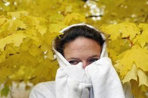 A woman with a hooded appearance