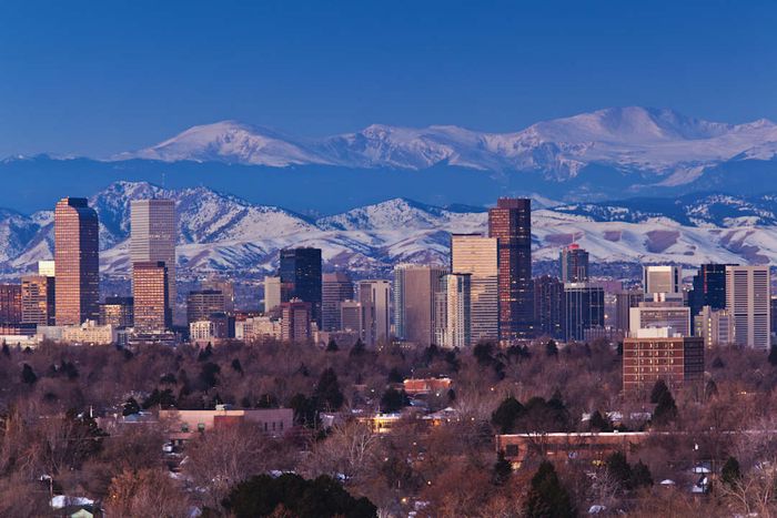 The Denver skyline framed by the majestic Rocky Mountains in the background