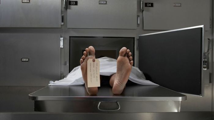 A deceased individual bearing an identification tag