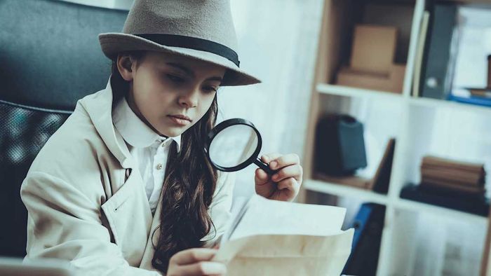 Young girl playing detective