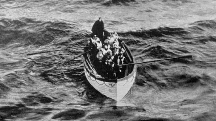 Survivors of the Titanic can be seen in a lifeboat, rowing toward safety after the ship tragically sank in 1912.