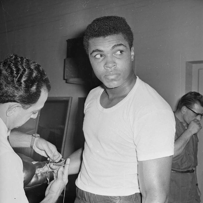 A photograph of Muhammad Ali is shown