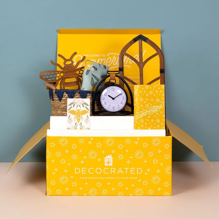 A Decocrated subscription box with items like a clock peeking through.