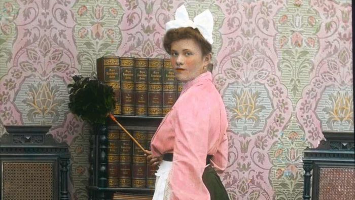 The parlour maid. Hand-colored lantern slide. Circa 1905 - 1910.