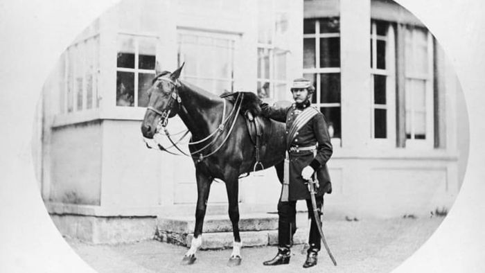 A British army cavalry soldier and his horse, circa 1875.
