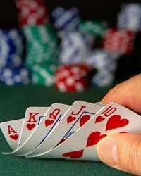 A man holding a deck of playing cards