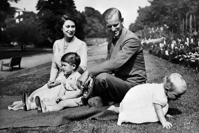 Queen Elizabeth and Prince Philip with two of their children, Prince Charles and Princess Anne, circa 1951.