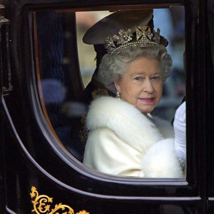 Queen Elizabeth in a carriage during the year 2000.