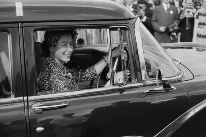 Queen Elizabeth II behind the wheel in 1958.