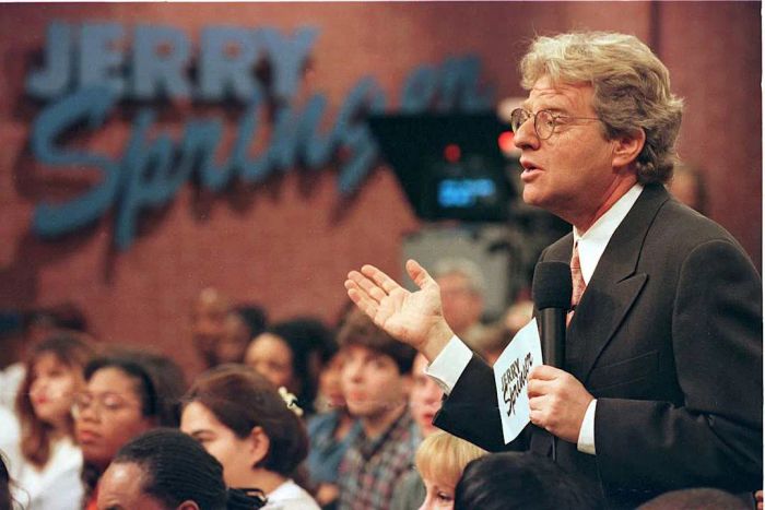 Jerry Springer engages with guests on his show on December 17, 1998.