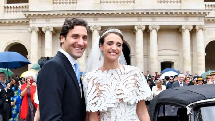 Jean-Christophe, Prince Napoléon, and his wife, Olympia Von Arco-Zinneberg, on their wedding day, with a statue of Napoleon overseeing the ceremony.