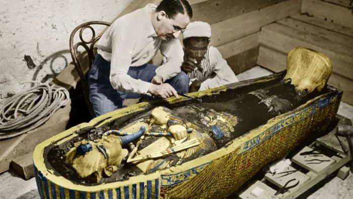 English Egyptologist Howard Carter inspects the golden sarcophagus of King Tutankhamun in Egypt in 1923.