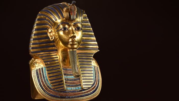 The iconic burial mask of the Egyptian Pharaoh King Tutankhamun.