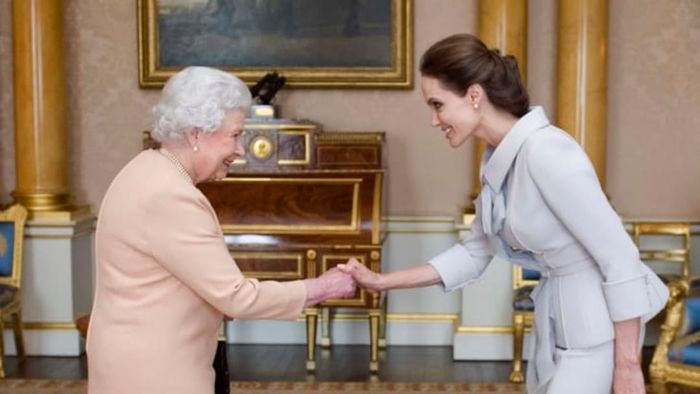 In 2014, Queen Elizabeth II awarded Angelina Jolie the Insignia of an Honorary Dame Grand Cross of the Most Distinguished Order of St. Michael and St. George.