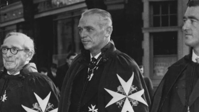 In 1958, actor Douglas Fairbanks Jr. was photographed wearing the mantle and insignia of a Knight of Justice of the Order of St. John.