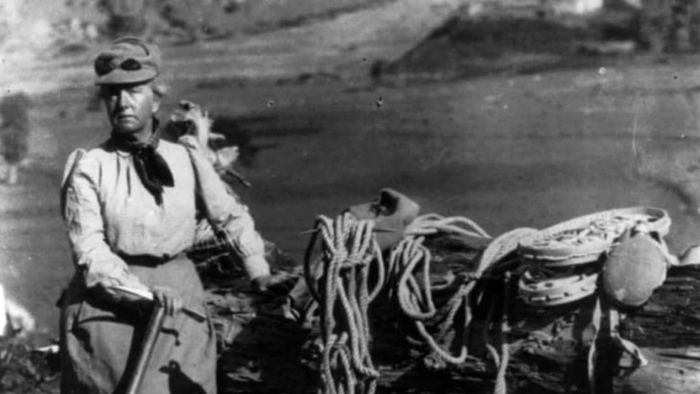 Fanny Bullock Workman dressed in mountain climbing attire.