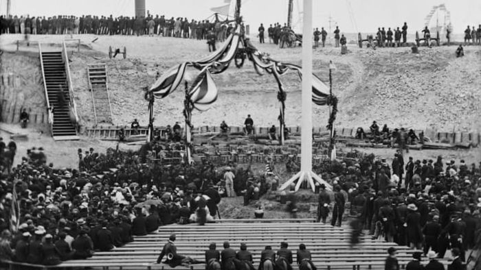 Hoisting the flag over Fort Sumter.