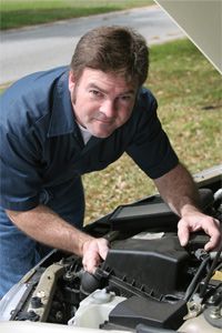 a person repairing a vehicle