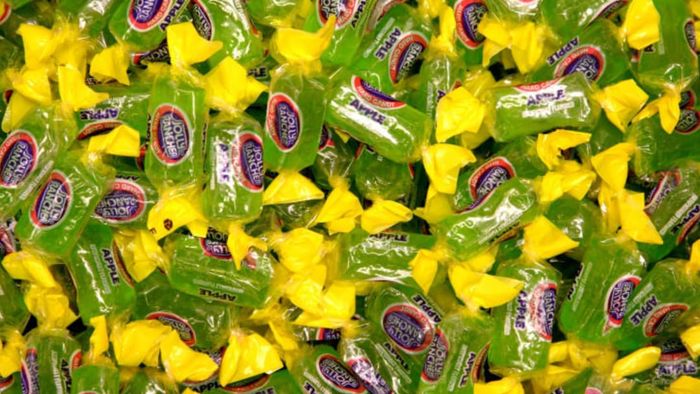 A bowl filled with Jolly Rancher candies.