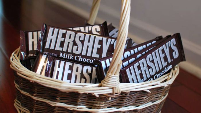 A basket filled with Hershey's chocolate bars.
