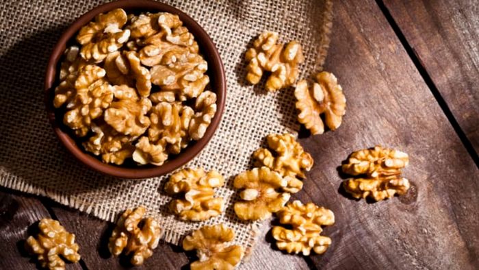 bowl of walnuts on wood table