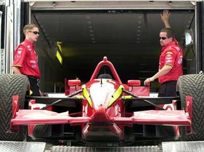 Unloading a race car from a trailer
